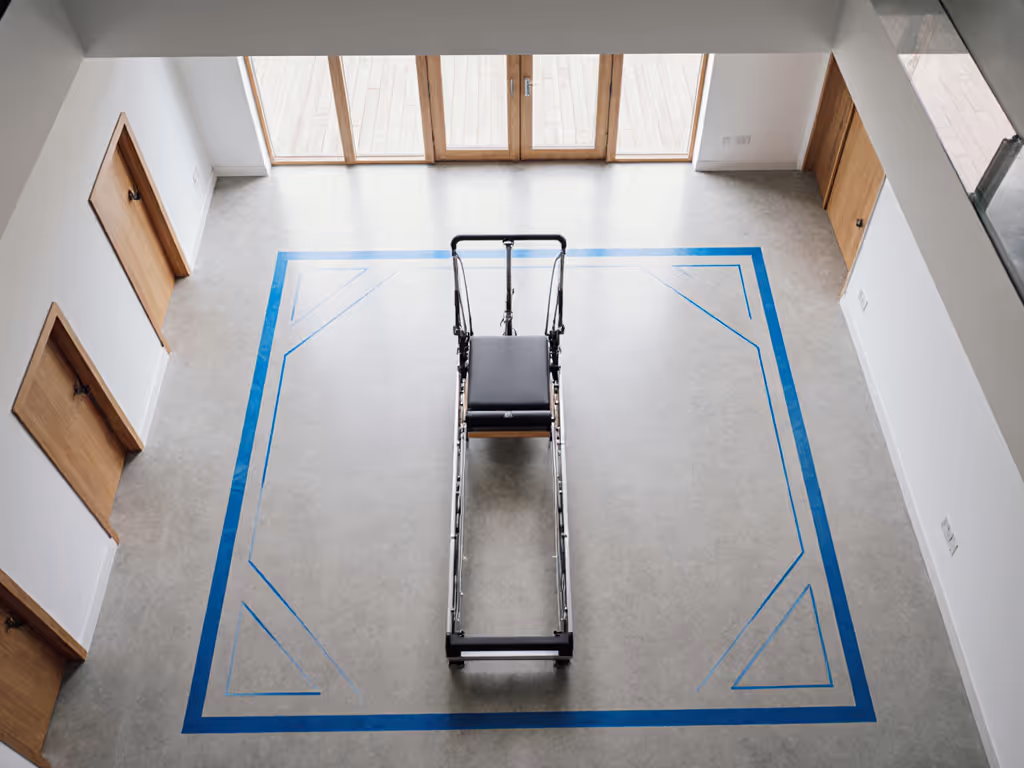 taped-out_reformer_footprint_showing_walking_lanes_and_clearance_zones